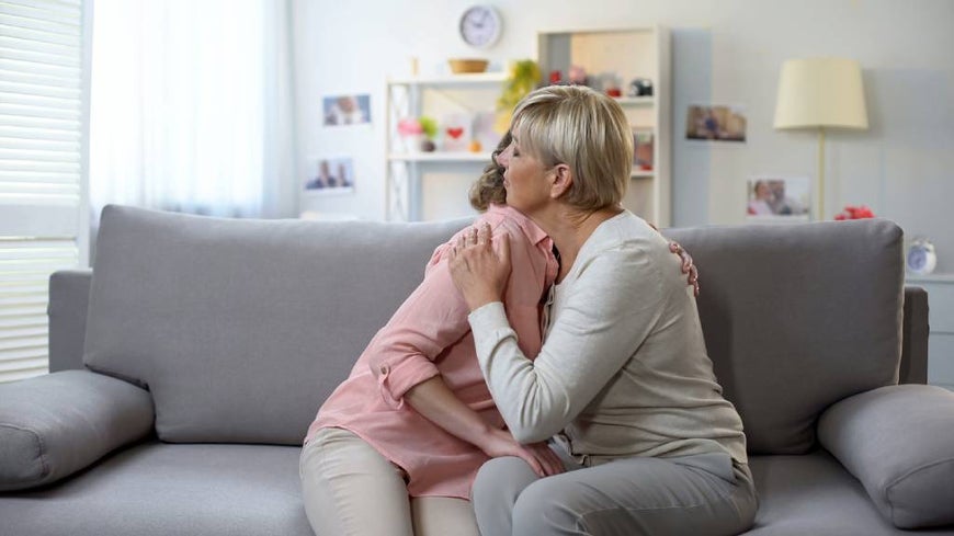 mother and daughter embracing