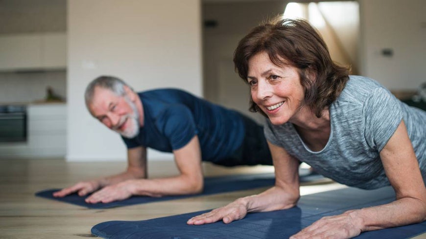 senior couple working out indoors