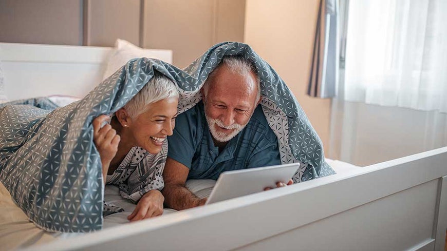 senior couple using laptop