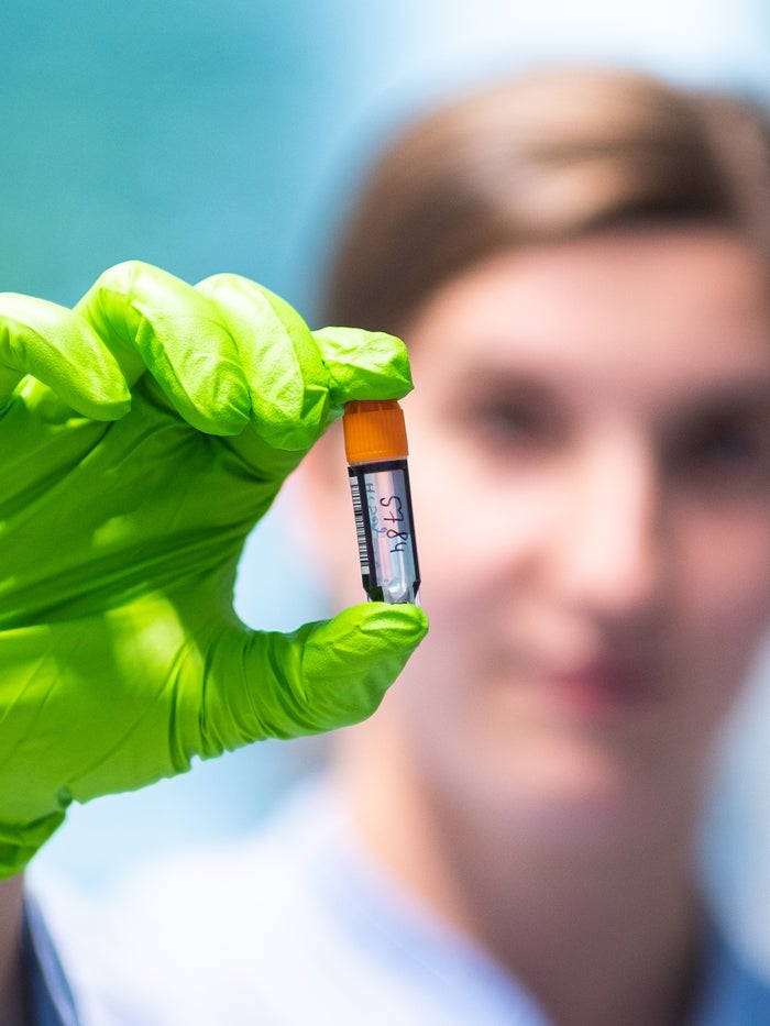 Lab workers shows his work Lab workers shows his work