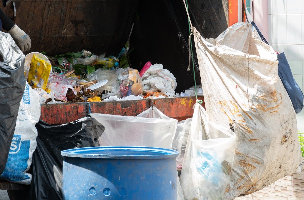 Mixture of household waste in bags and bins