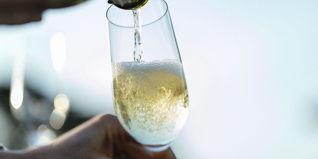 Sparkling wine being poured into glass