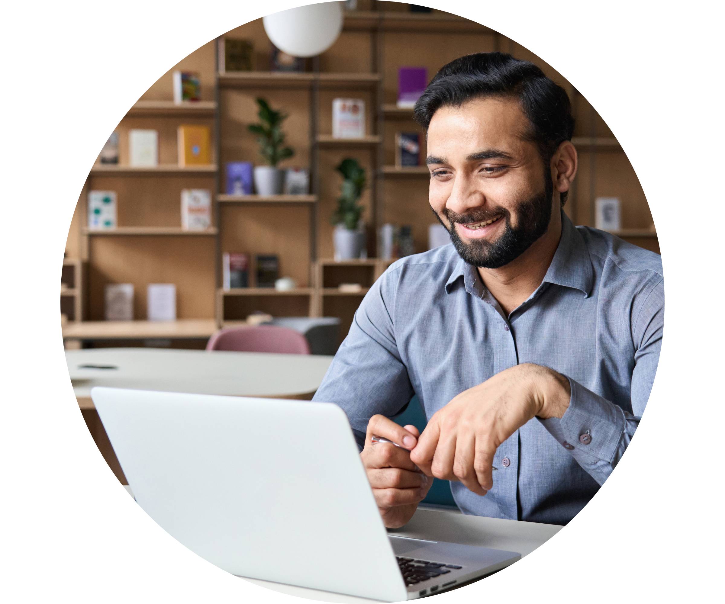 Man on laptop claiming private health insurance rebate for psychology sessions