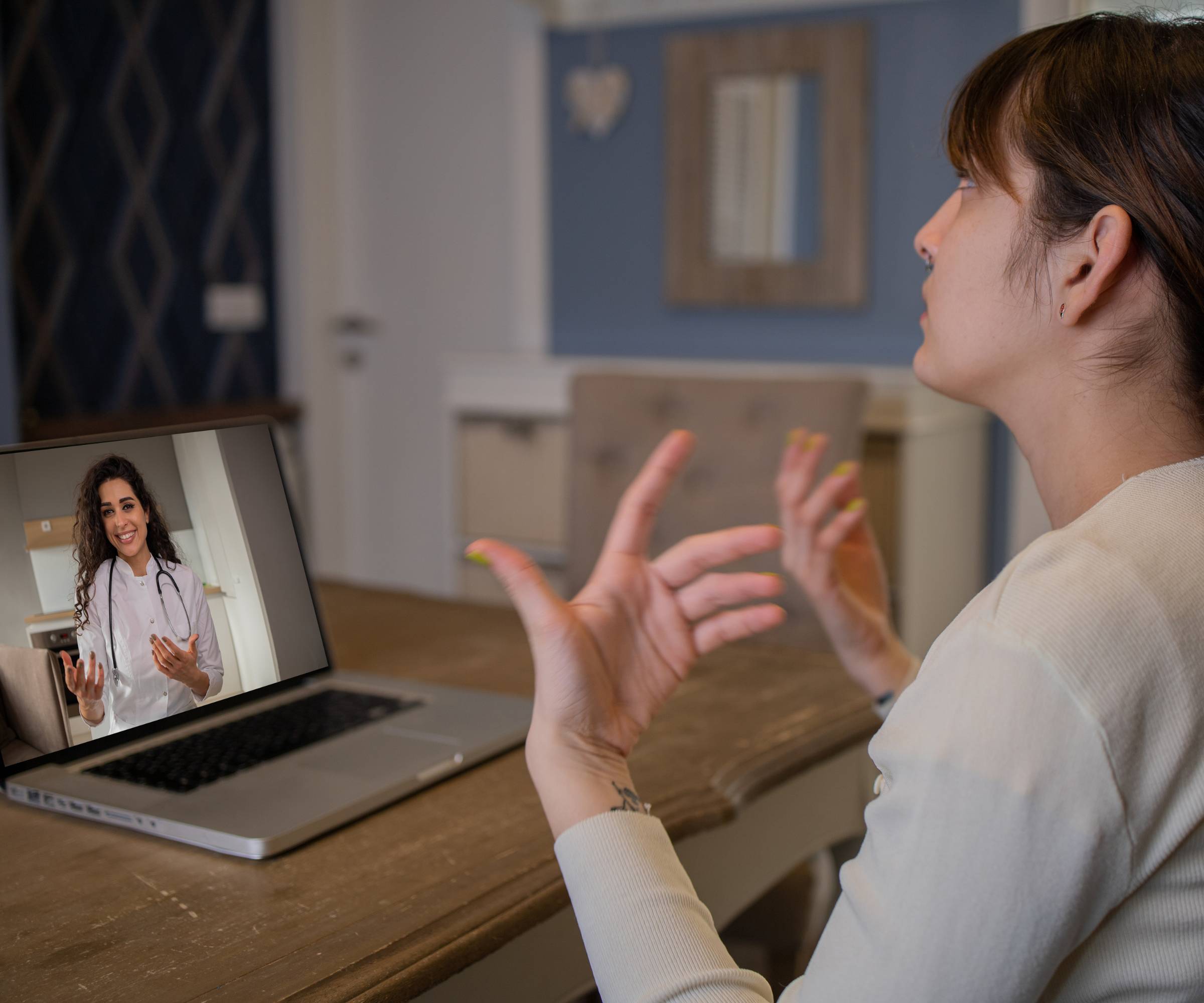 online doctor talk with client through laptop