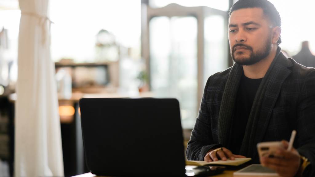 man working on a laptop 