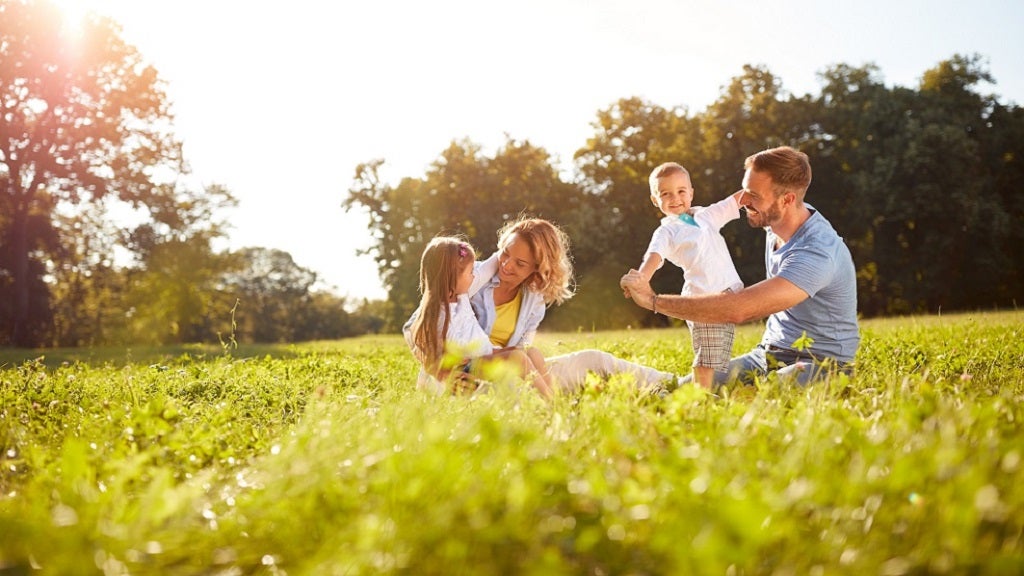 New Zealand family playing in a park