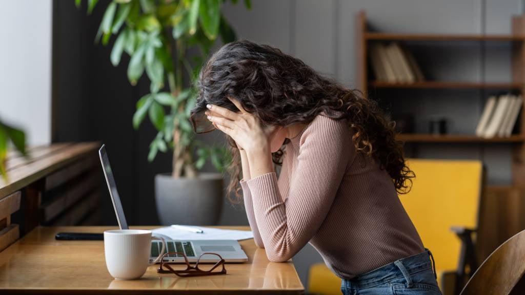 Stressed woman at desk