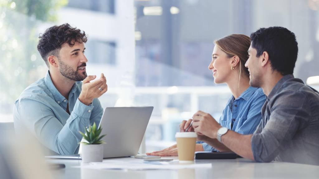 Financial advisor speaking to a man and woman