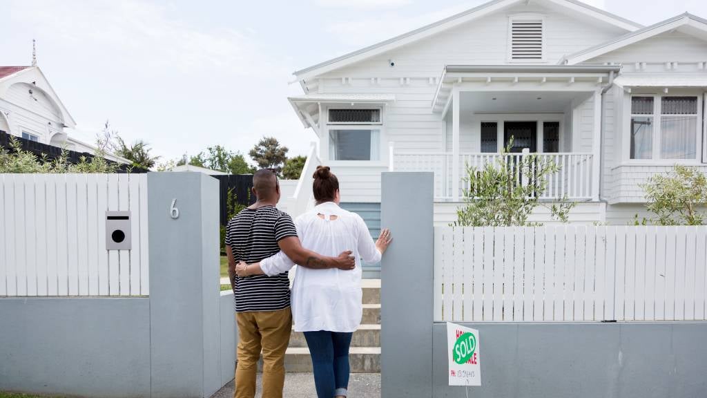 Couple looking at house that is sold