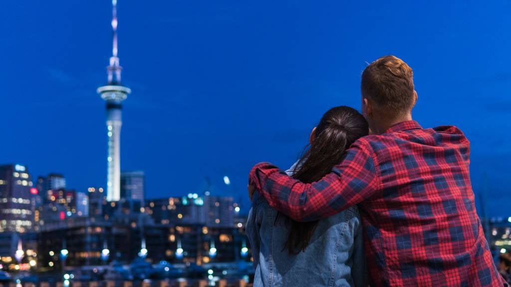 Couple sitting together and enjoying a lovely evening in Auckland City