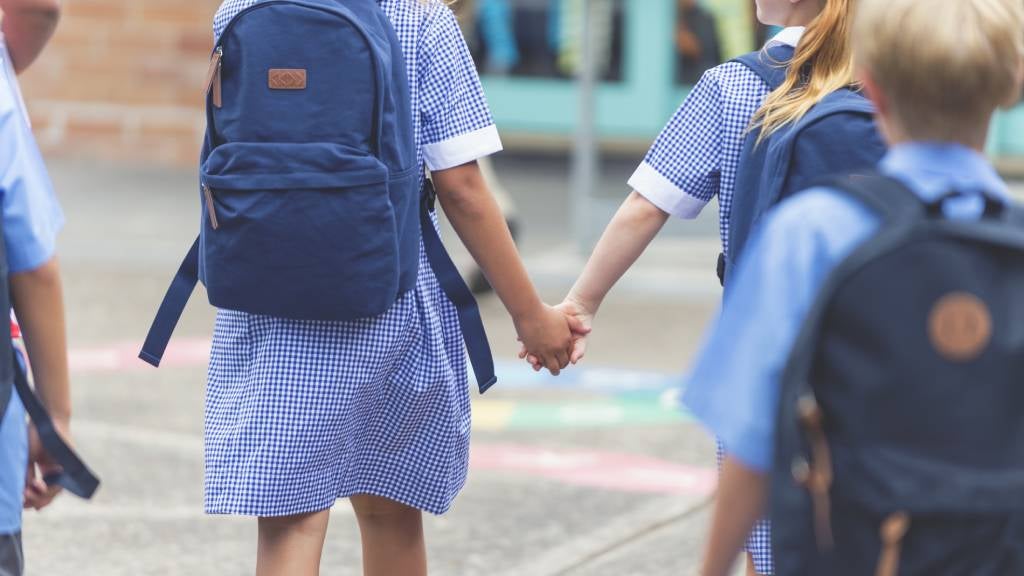 Kids in the playground holding hands