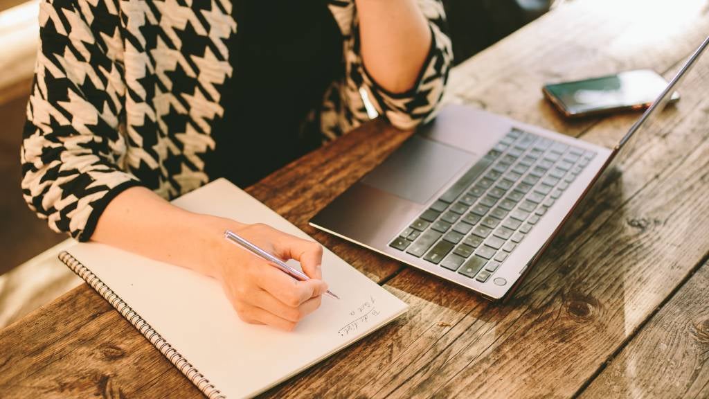 Woman writing a to-do list