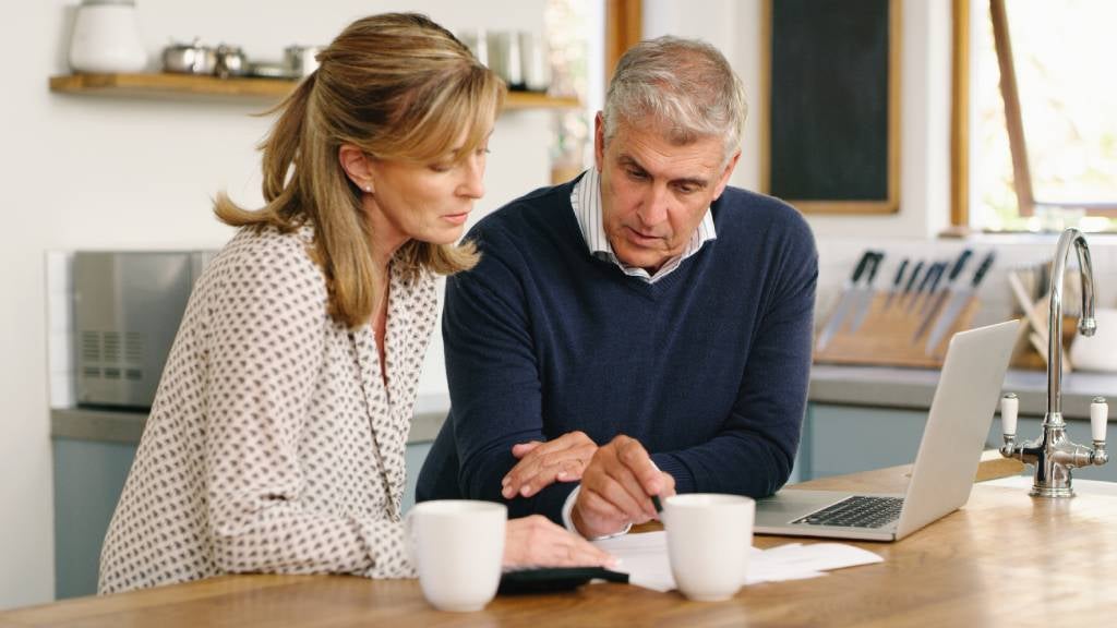 Man and woman looking at documents