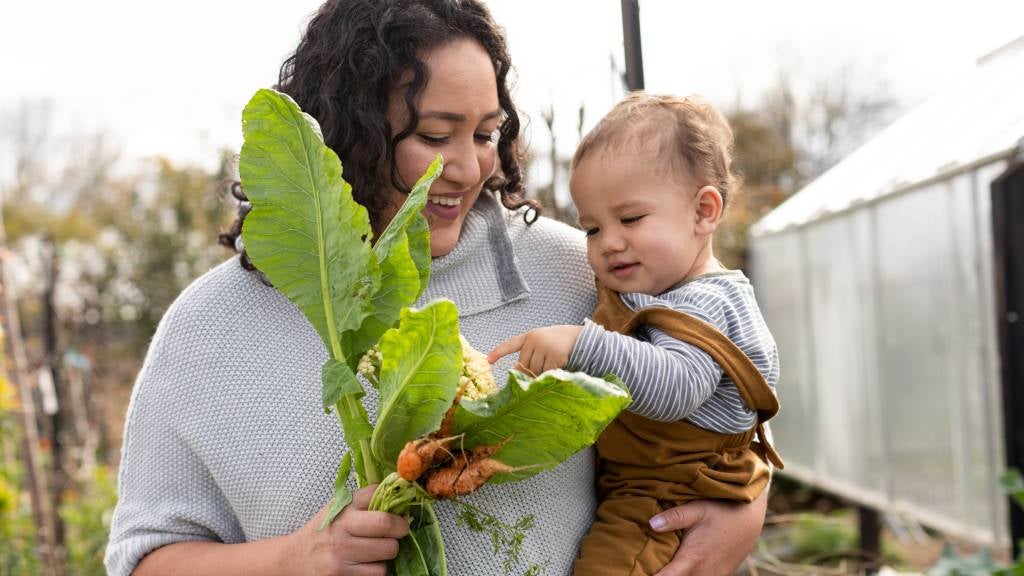 Mother and baby in the vegetable garden