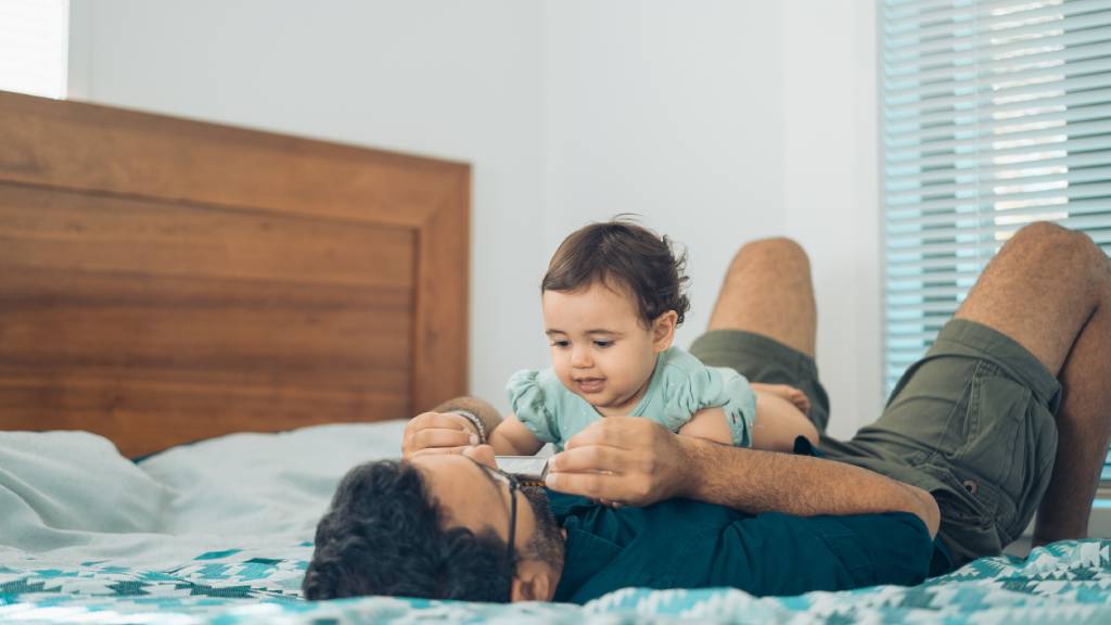 middle aged father playing with child