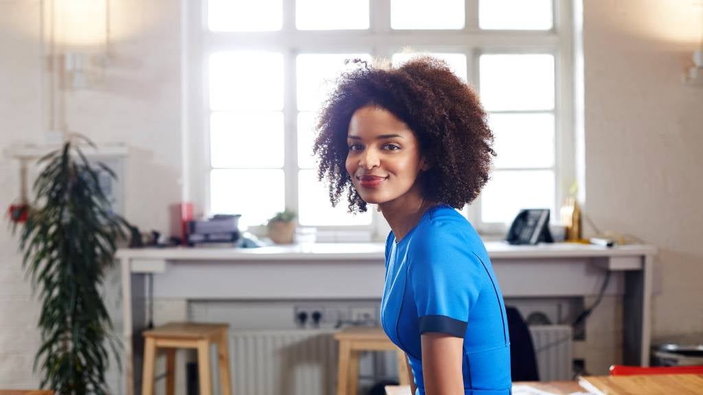 A woman smiling at the camera