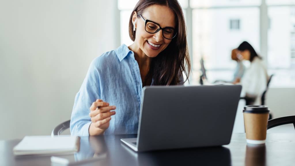 A woman having an online meeting in an office