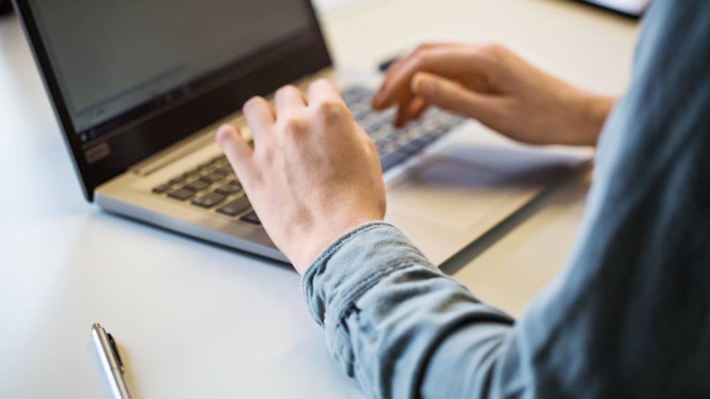 Close up of a businesswoman working on laptop