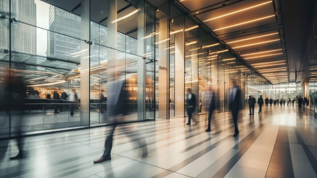 Time-lapse of people walking through the foyer of an office block