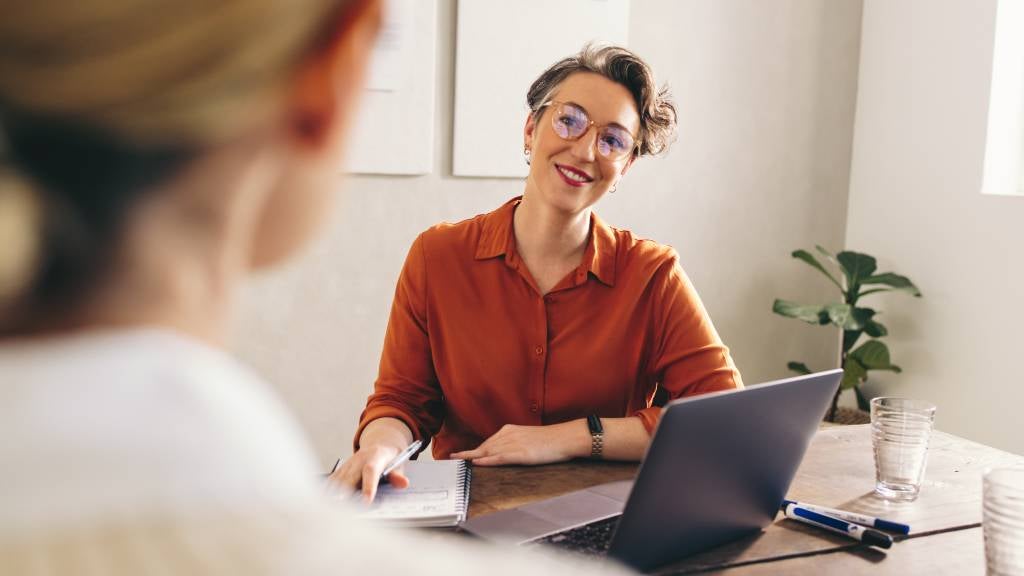 Manager interviewing a job candidate in her office