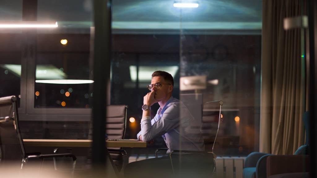 Male employee working late in the office