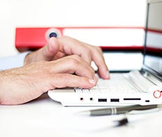 User typing on computer