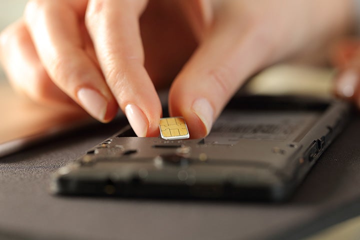 sim chip being held over device