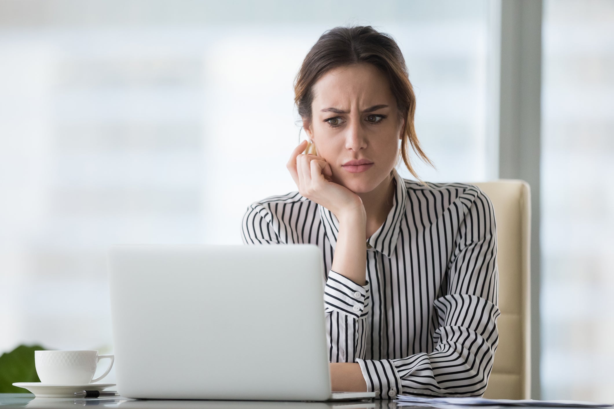 Woman frowning at computer