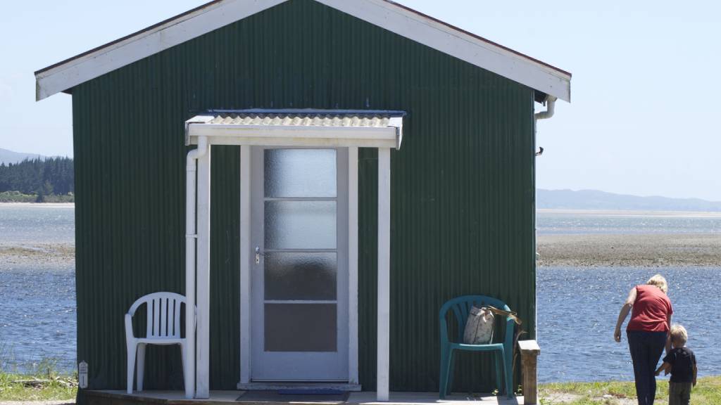 grandmother with child at beach house