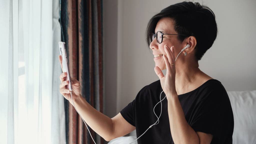 older woman talking to friends on phone