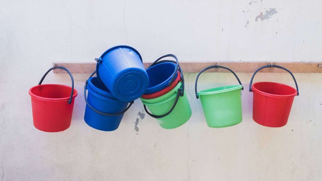 colourful buckets hanging on wall