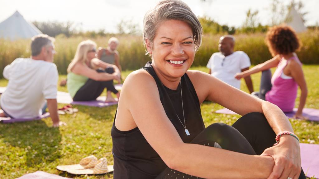 woman exercising with group