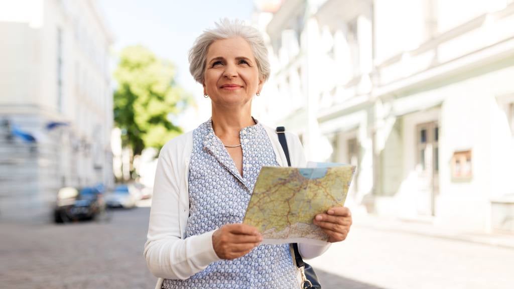 Woman reads travel map