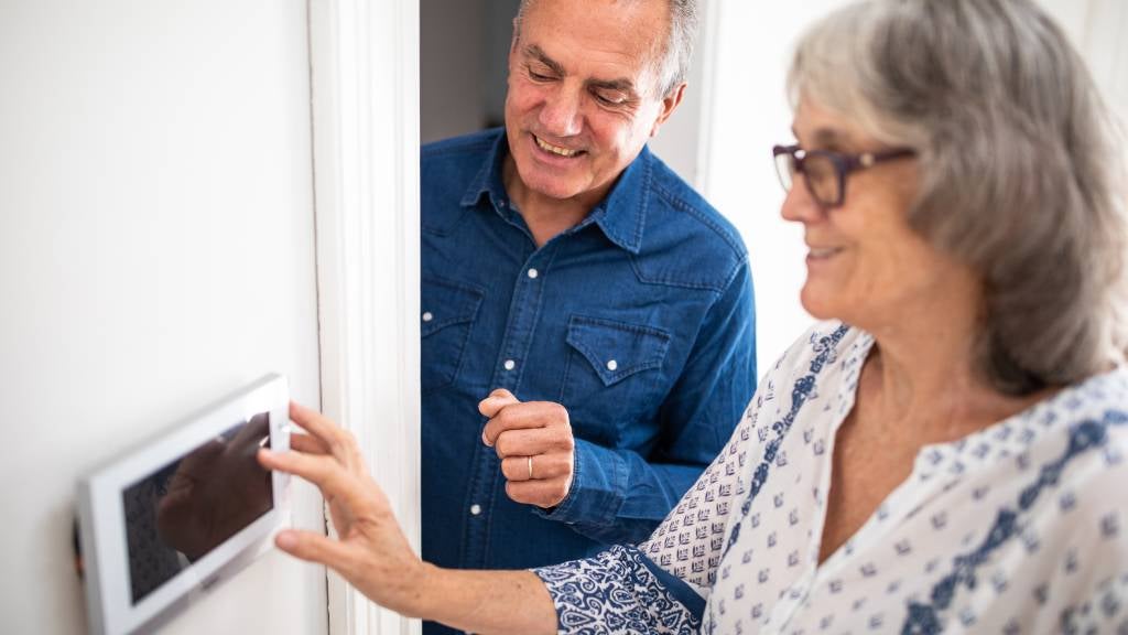 Couple install home security system together 