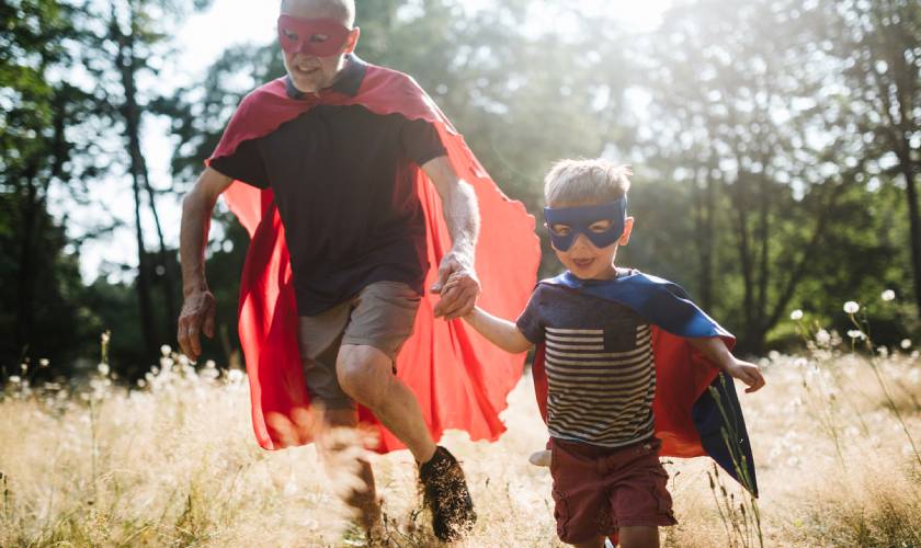 grandfather and grandson dressed as superheroes