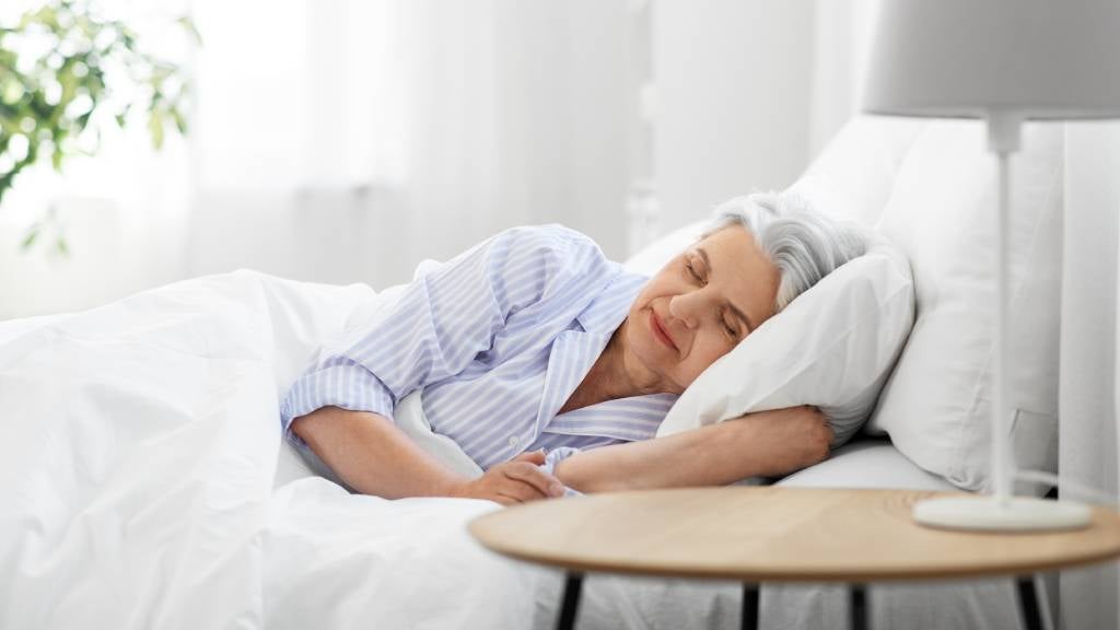 Senior woman asleep in bed