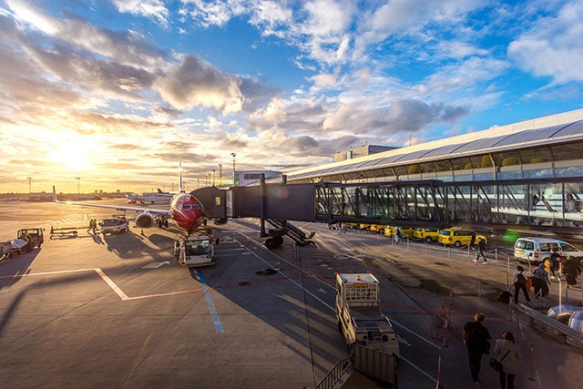 Plane at airport in sunlight