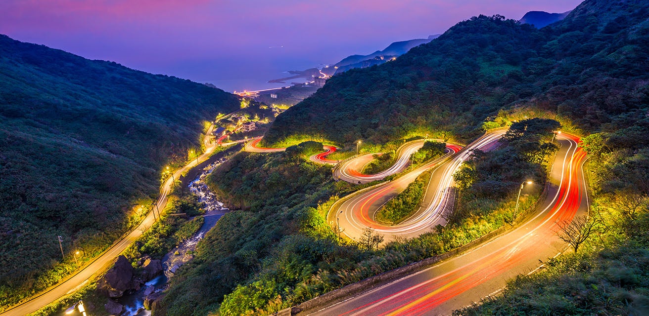 Winding road at sunset