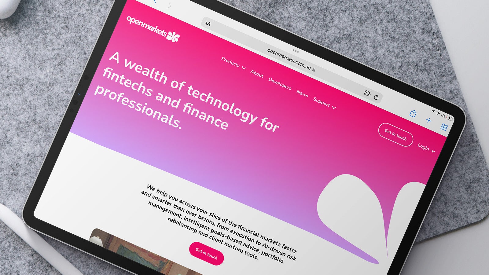 Openmarkets website shown on an iPad, which is sitting on a desk | Devotion