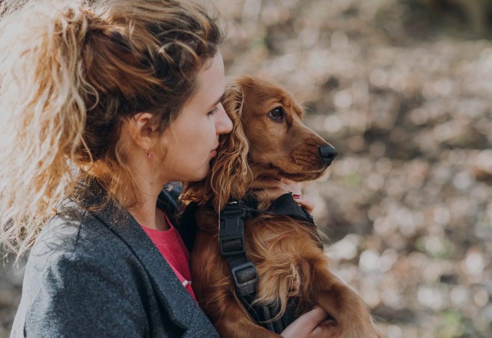 EAC Animal Care | Photo of a woman holding her dog | Devotion