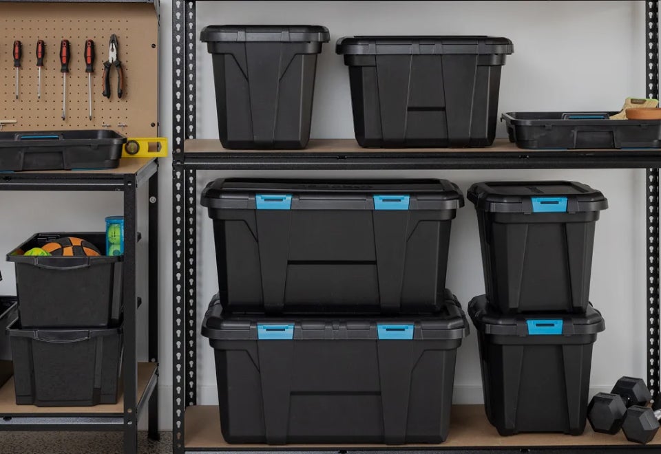 Inabox Solutions | Shelves in a garage with a series of Inabox storage tubs on the shelves | Devotion