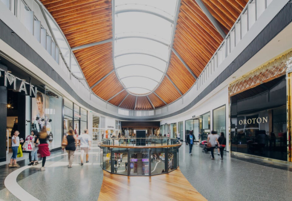 GPT | Highpoint Shopping Centre photograph showing shops and people walking | Devotion