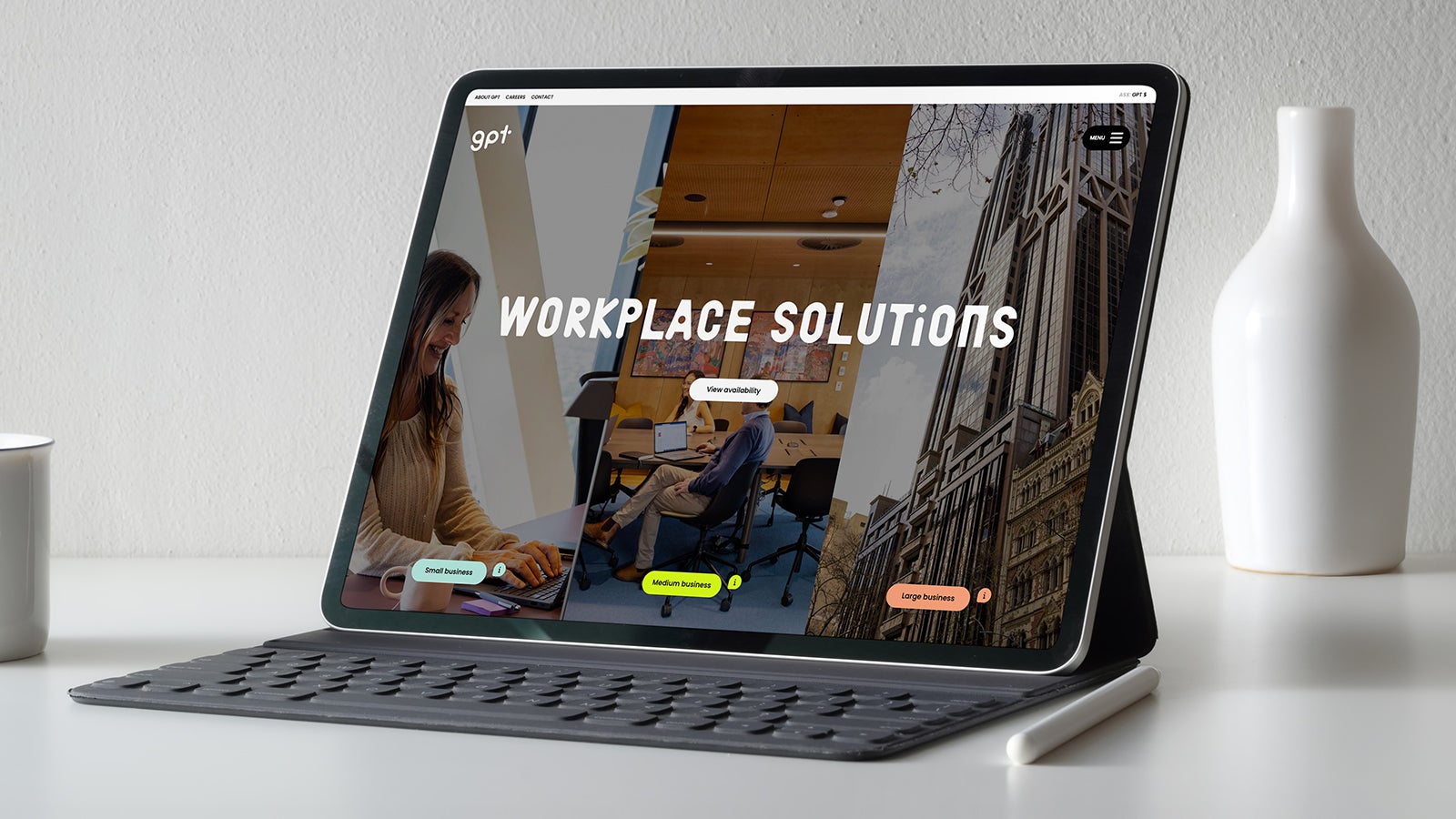 GPT Workplace | An Apple iPad sitting on a desk next to an Apple Pencil and vase with the GPT Workplace homepage shown on the screen | Devotion