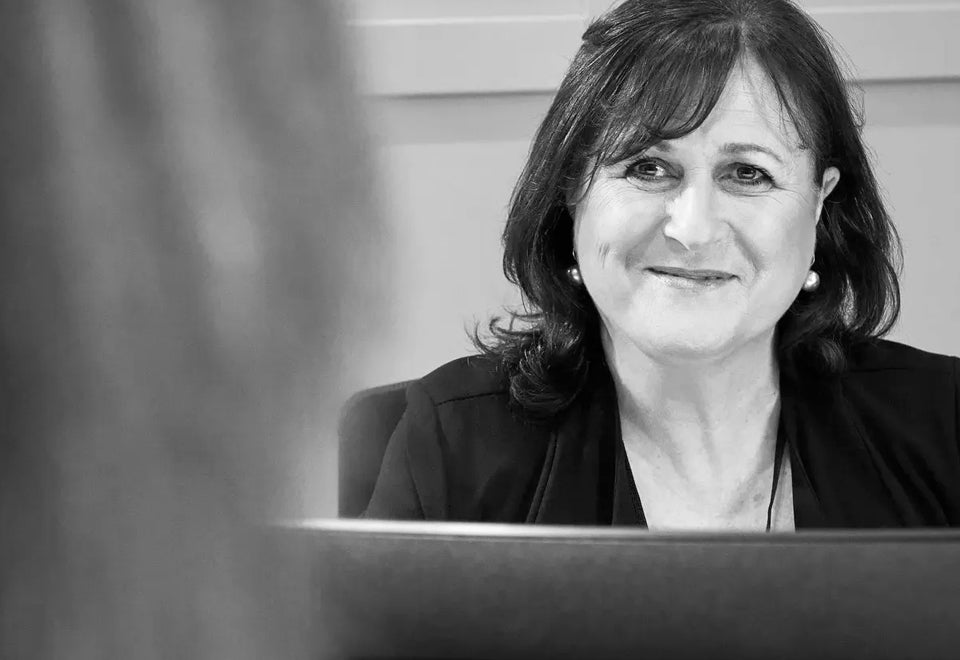 RMBL | A female member of the RMBL team, looks towards the camera and is in conversation with someone out of shot | Devotion